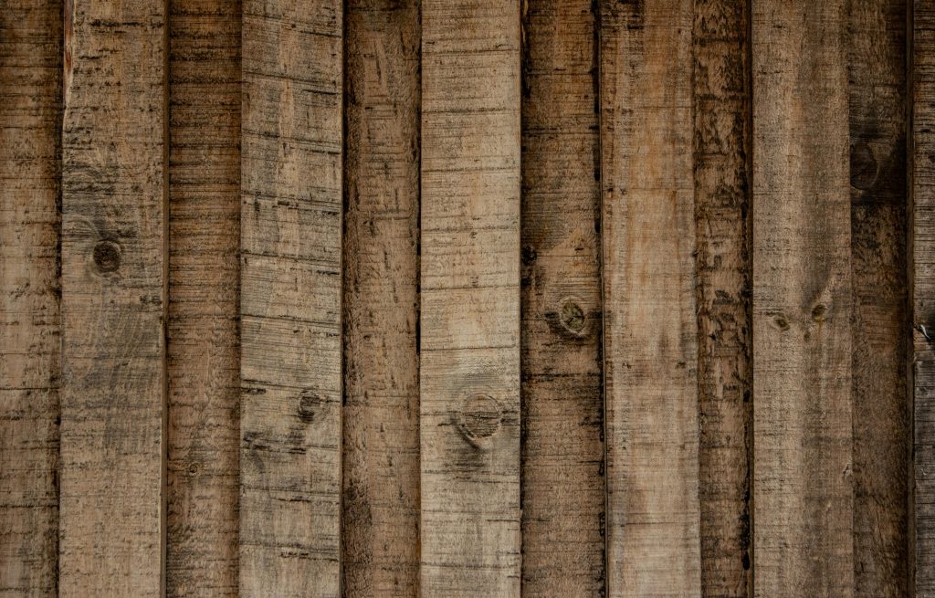 Detailed close-up of a rustic wooden wall showing natural texture and grain.